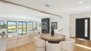 Modern coastal living room with canal and wetlands view in Newport Beach home