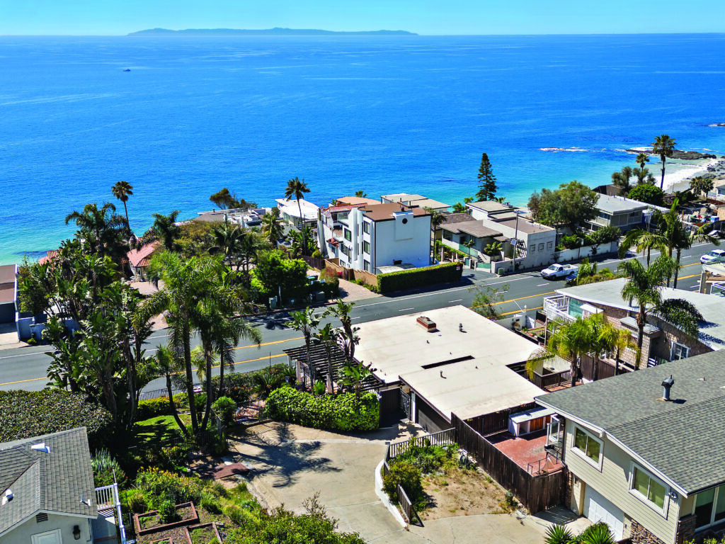 Laguna Beach coastal home near the ocean with panoramic views, palm trees, and Pacific coastline