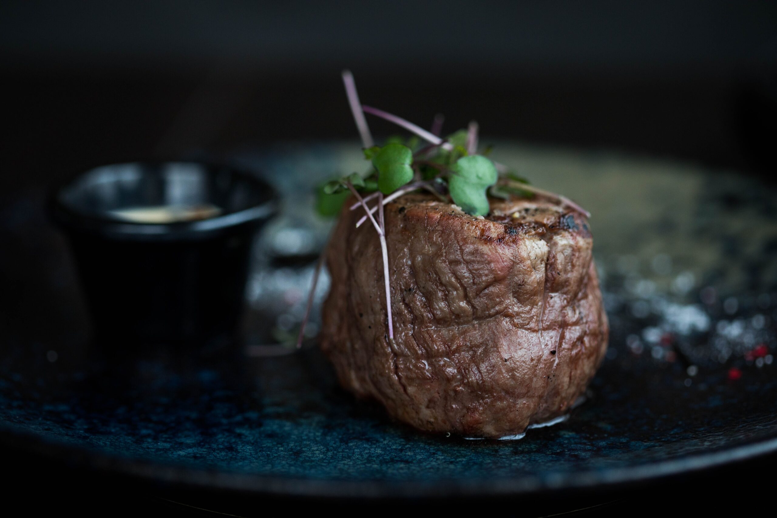 rilled filet mignon topped with microgreens, representing the best steakhouses in Orange County.